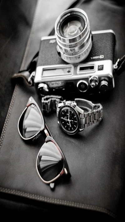 Timeless Style: Camera, Sunglasses, and Watch Arrangement