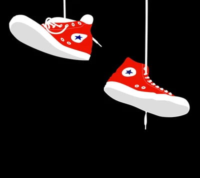 Red Converse Sneakers Hanging Against a Black Background