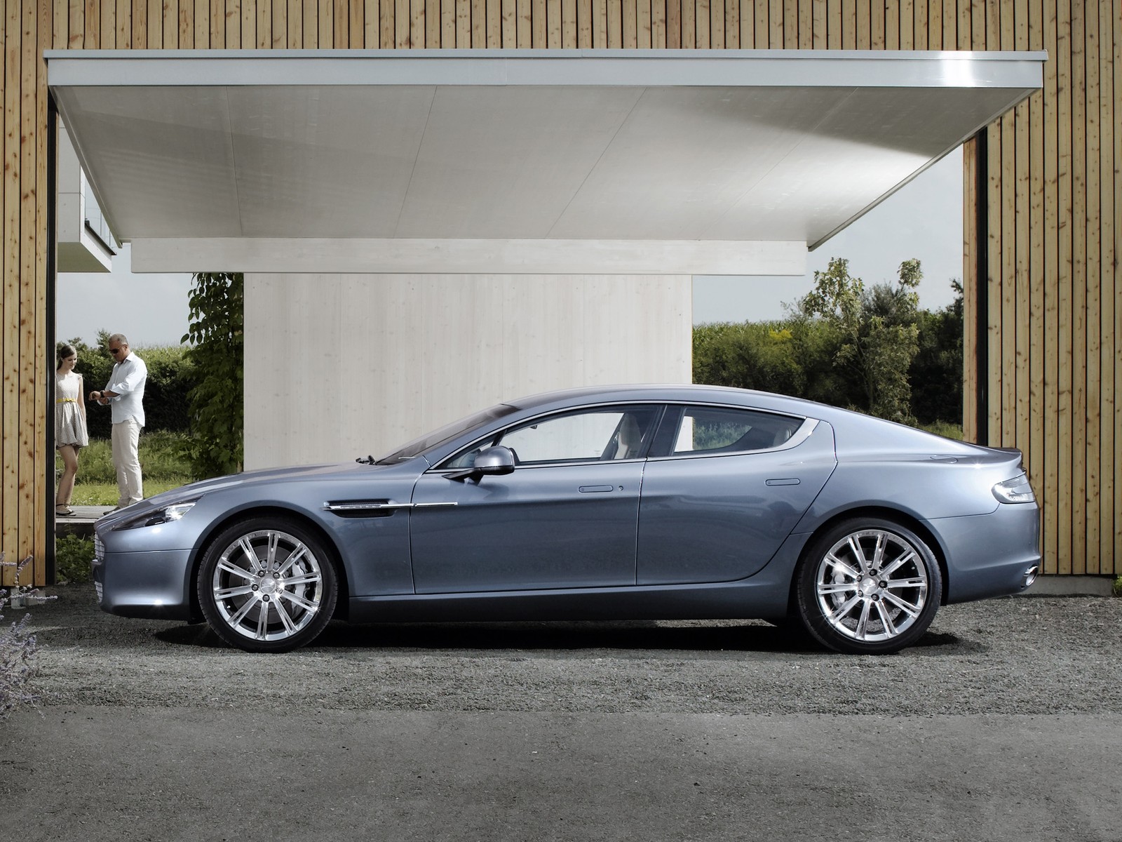 A close up of a car parked in front of a building (international motor show germany, aston martin vantage, aston martin dbs v12, aston martin db9, aston martin one 77)