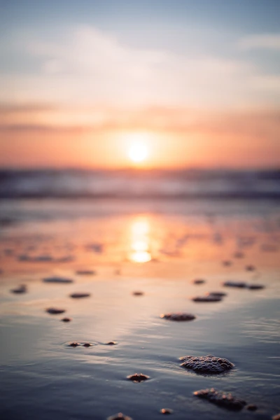 Tranquil Sunset Reflections on Calm Ocean Waters