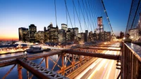 Vibrant City Skyline at Dusk with Iconic Bridge