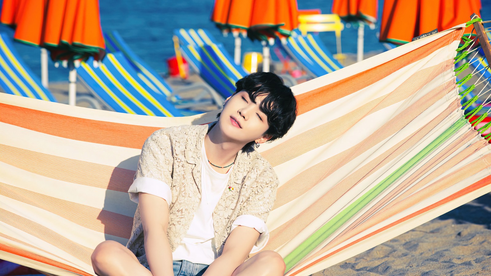 Arafed woman sitting in a hammock on a beach (bts, 방탄소년단, k pop, korean, boy group)