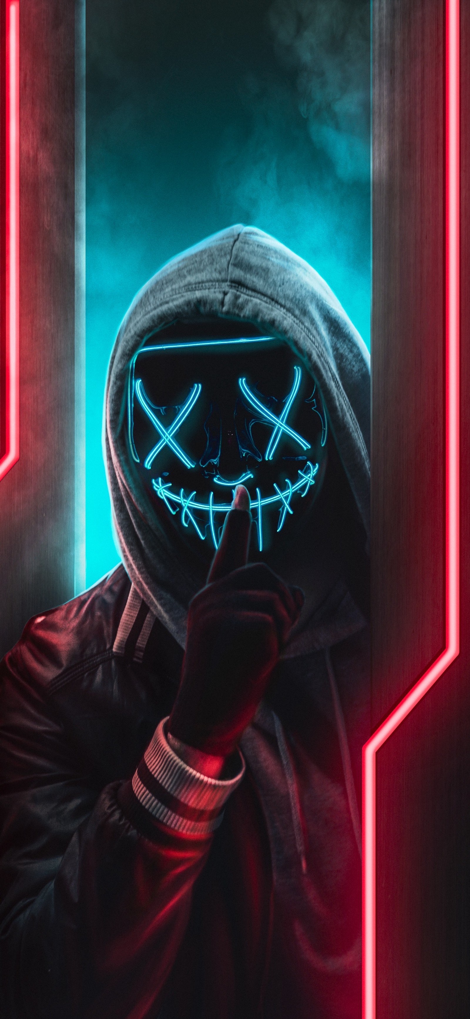 A close up of a person wearing a neon mask in a dark room (neon, purple, sleeve, gas, electric blue)