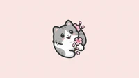 Adorable gatito con flores de cerezo sobre fondo rosa suave