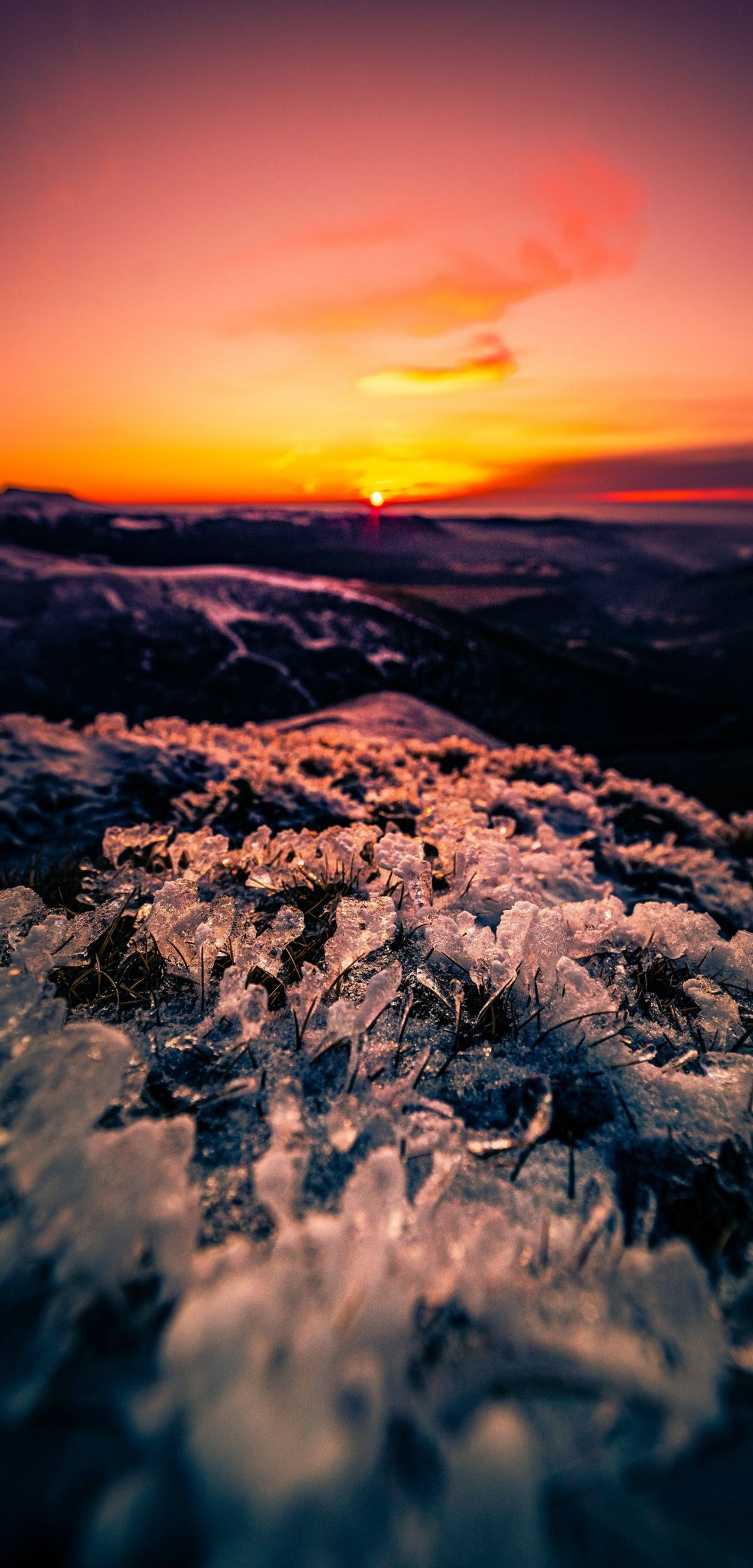 Sunset over the ocean with ice crystals on the shore (sunset, wall, atmosphere, ecoregion, natural landscape)