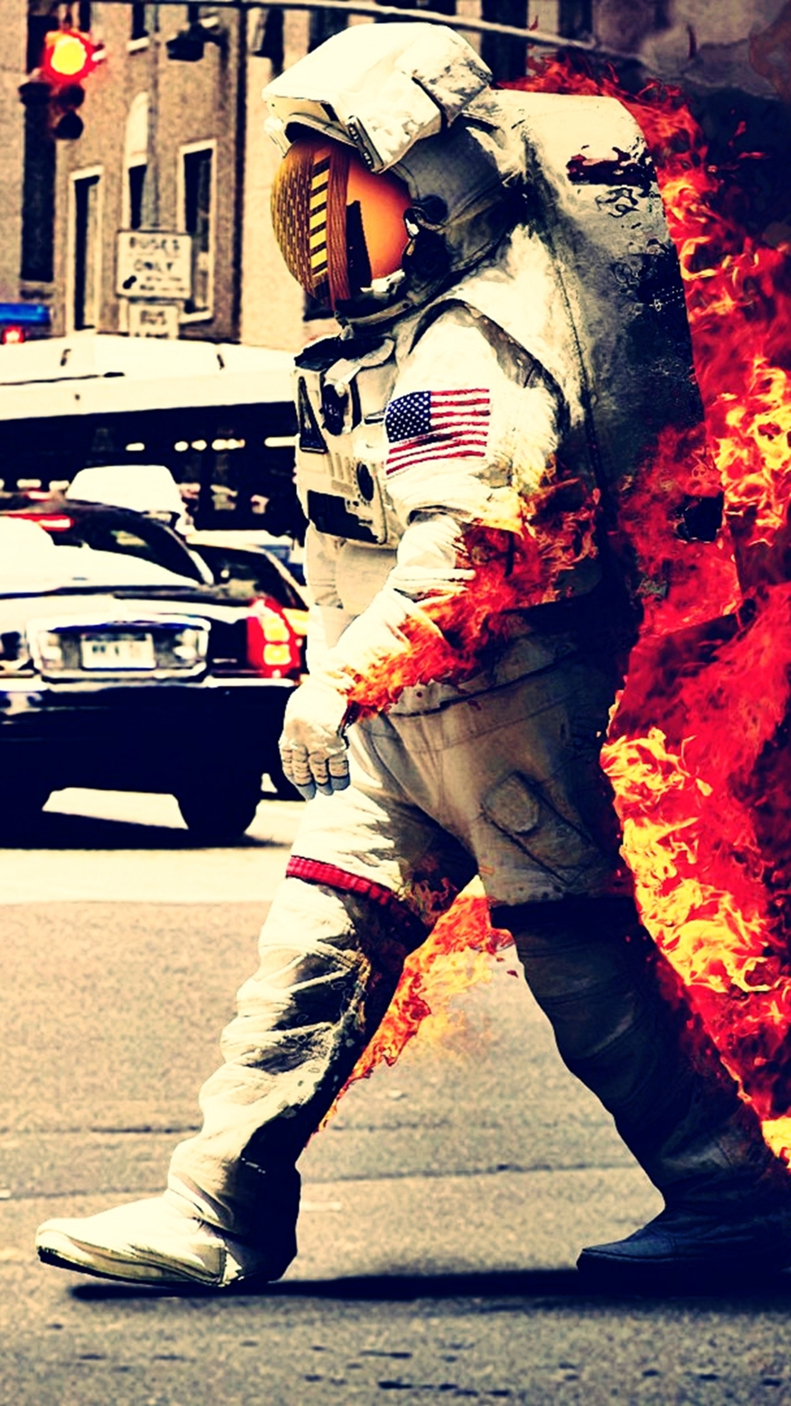 Arafed astronaut walking on the street with fire in his hand (astronaut, space)