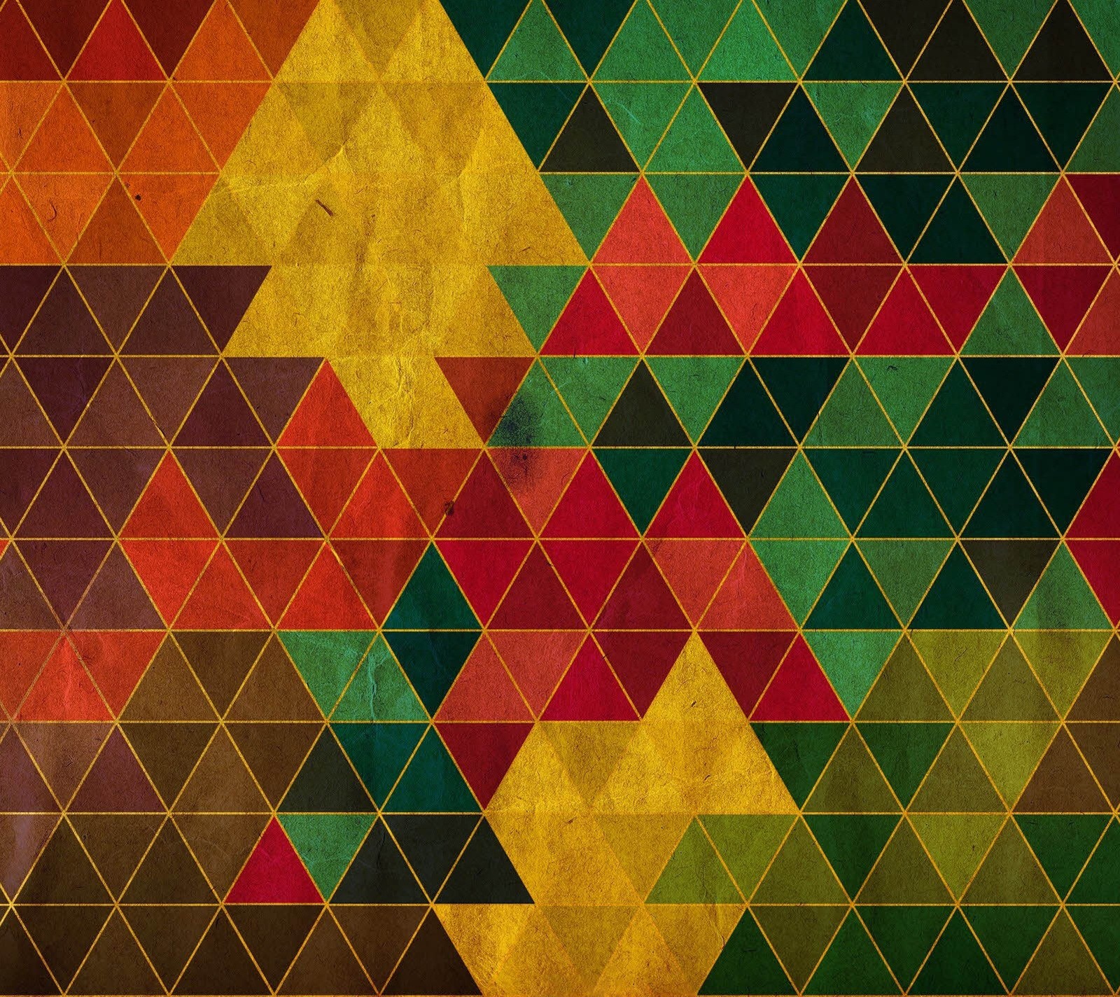 A close up of a colorful pattern of triangles (black, brown, colours, green, red)