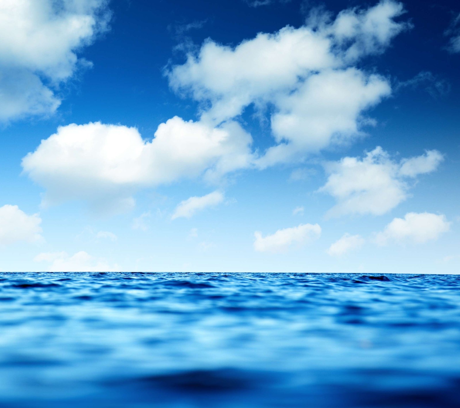 A close up of a body of water with a sky background (blue, clouds, horizon, nature, ocean)