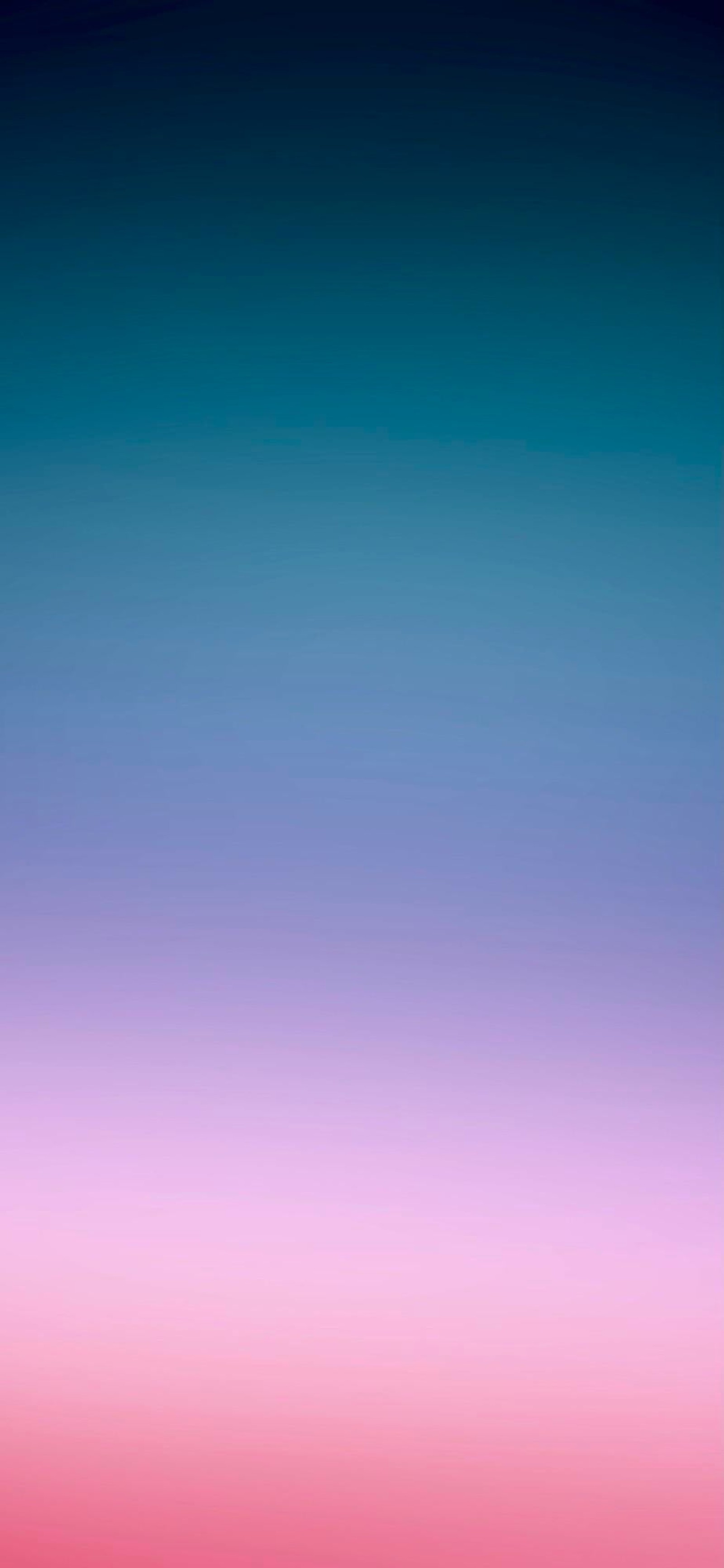 Vue aérienne d'un avion volant dans un ciel rose et bleu (mathématiques, azur, violet, bleu électrique, magenta)