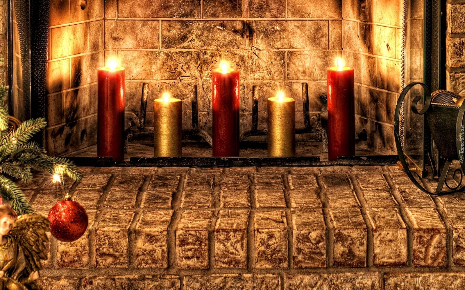 Candles are lit in front of a fireplace with a christmas tree (christmas day, lighting, candle, holiday, christmas)