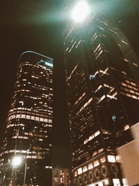 Illuminated Skyscrapers in a Vibrant Night Cityscape