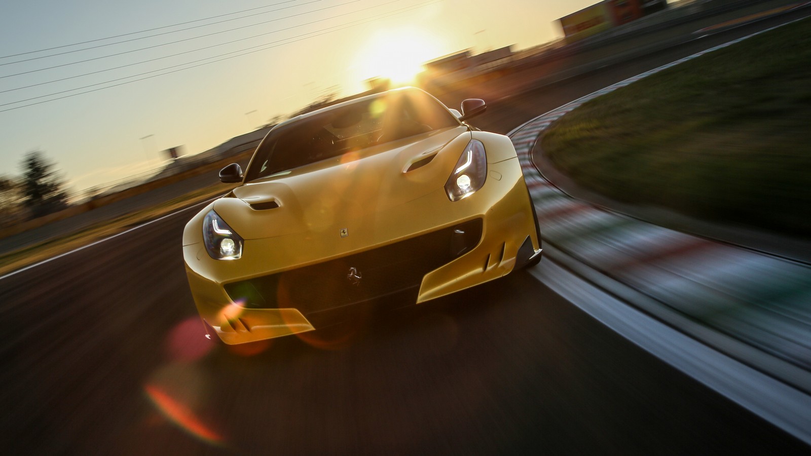 A close up of a yellow sports car driving on a track (sports car, ferrari 488, supercar, yellow, automotive design)