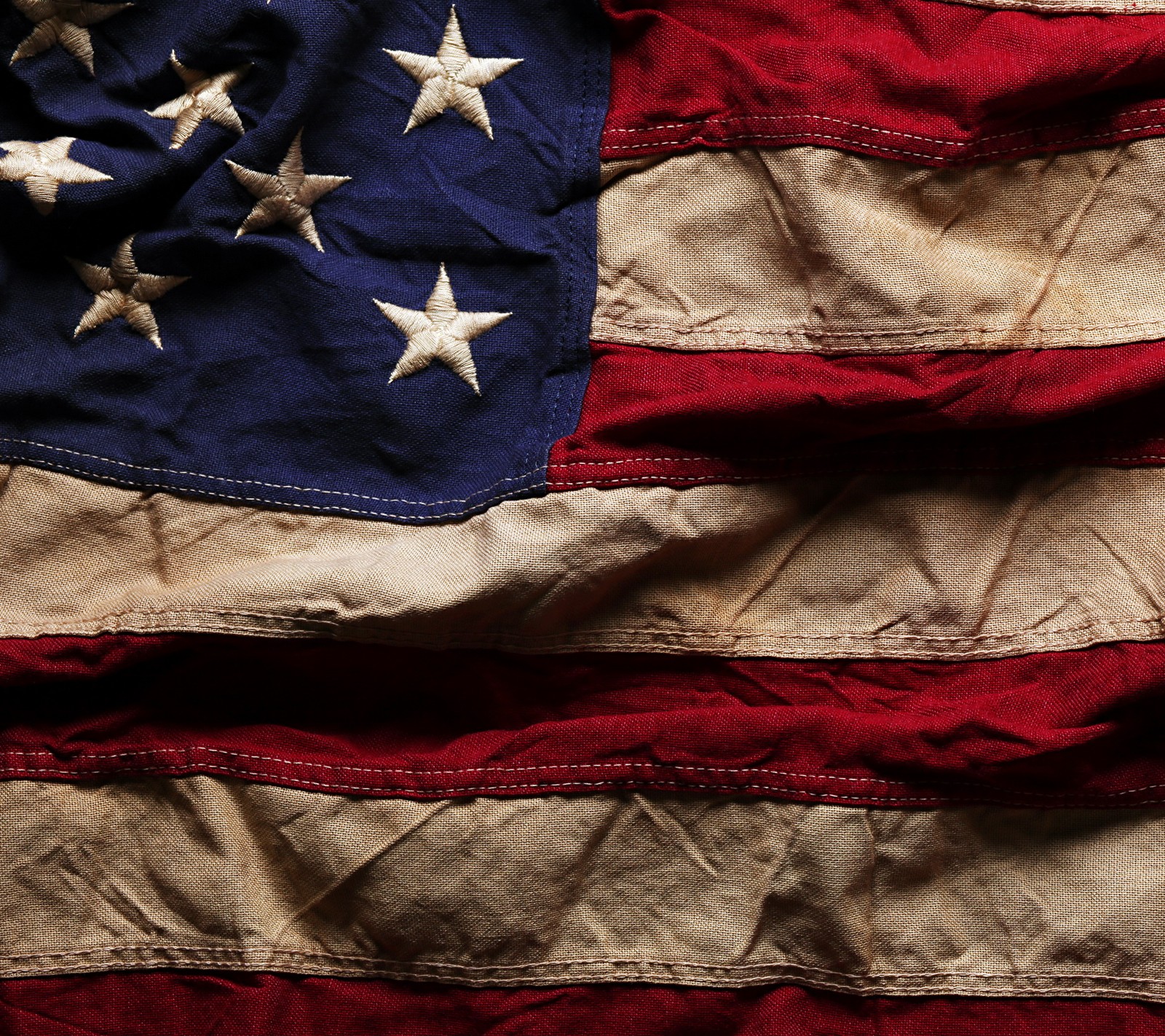 An old american flag is displayed on a table (abstract, flag, grunge, usa, zedgeamerica)