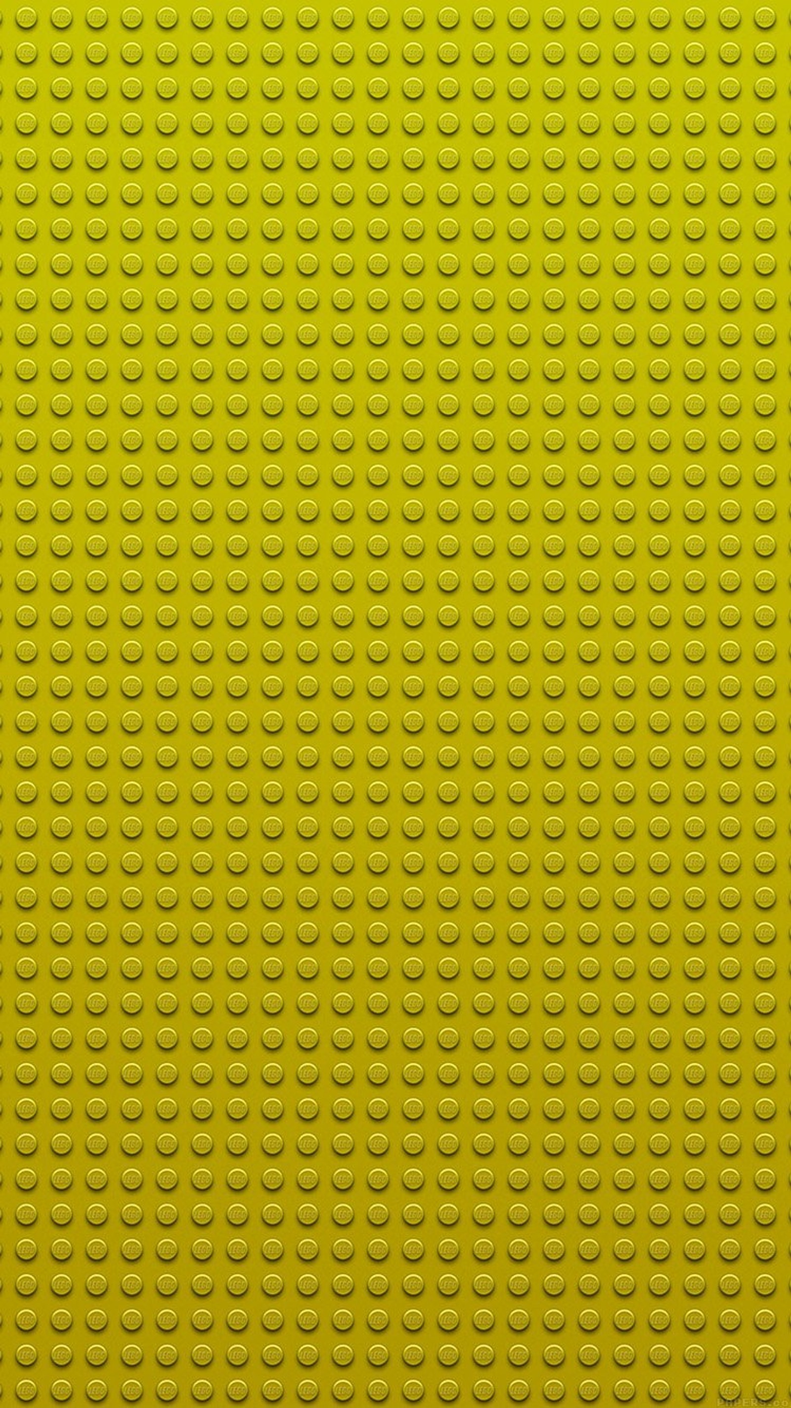 Nahaufnahme einer gelben lego-wand mit vielen kreisen (abstrakt, lego, muster, textur, gelb)