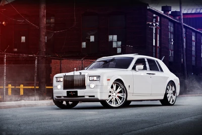 Luxury Rolls Royce Sedan with Custom Rims on Urban Street