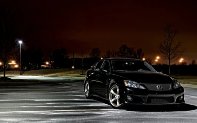 Sleek Black Lexus IS with Alloy Wheels Under Night Lights