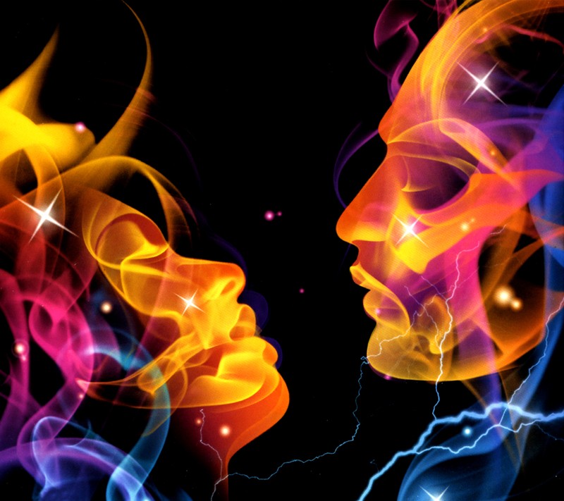 Two faces of a man and a woman with bright colored smoke (abstract, love)