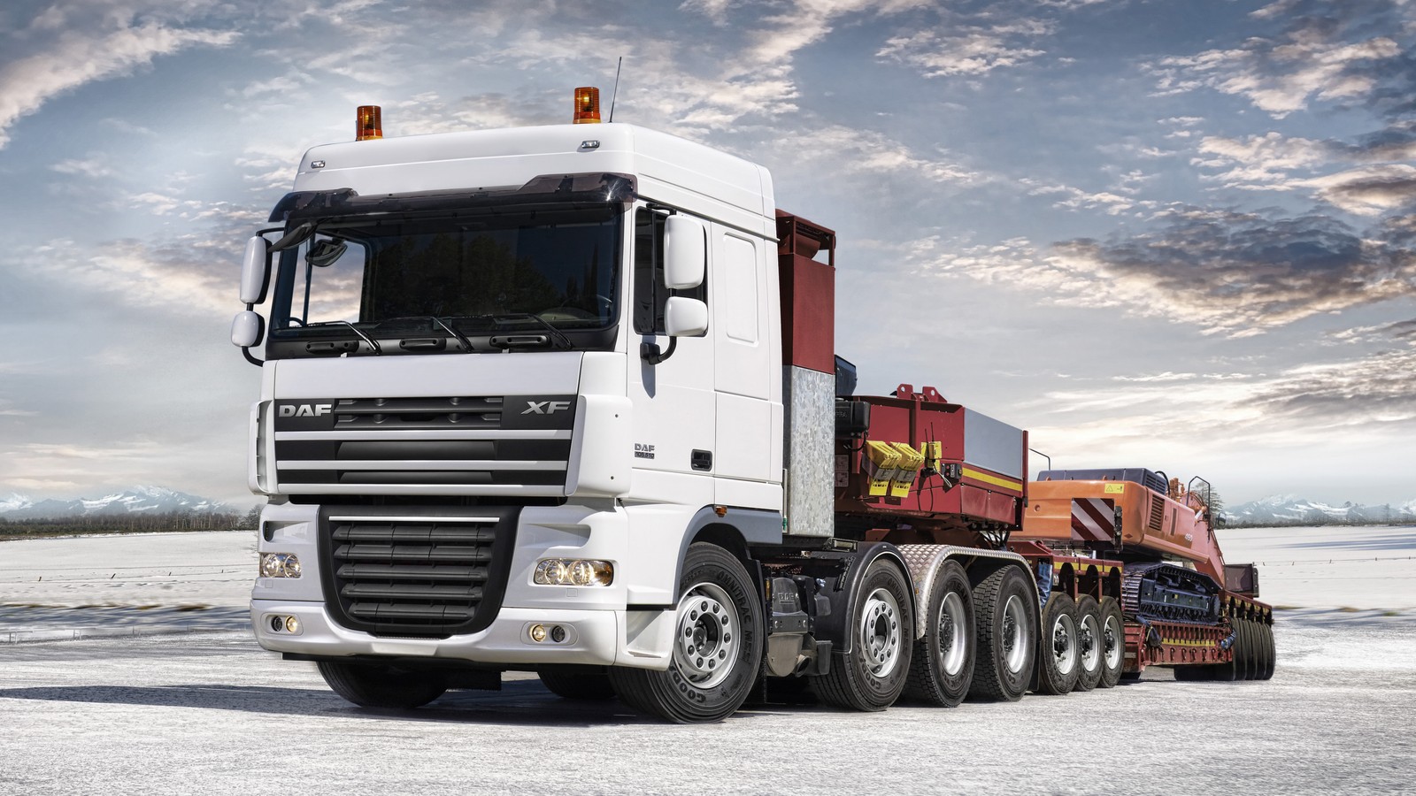 A close up of a semi truck with a trailer on a snowy surface (daf trucks, truck, transport, trailer truck, semi trailer truck)