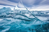 Glacial Serenity: A Crystal Ice Peak Against the Arctic Sky