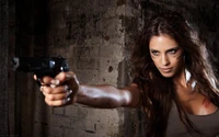 Empowered Model Aiming a Handgun in an Urban Setting