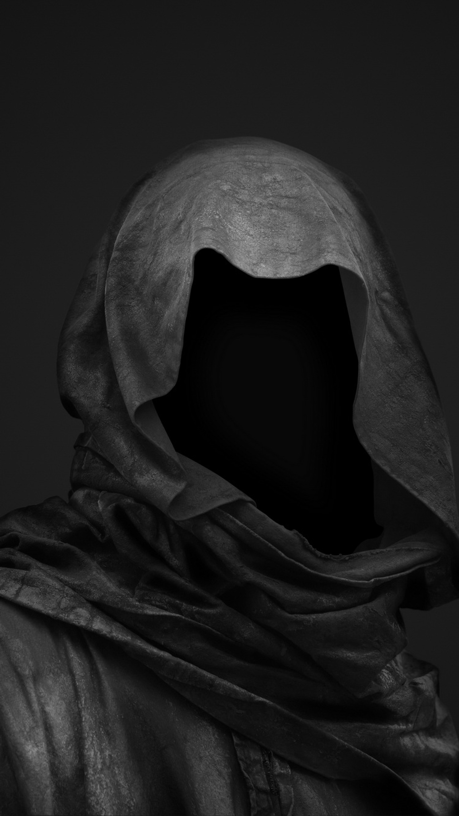 A close up of a person wearing a hoodedie and a scarf (black, dark, hidden, horror, mask)