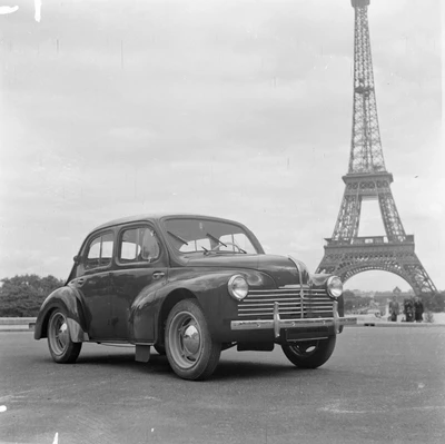 Vintage Renault Sedan in Front of the Eiffel Tower