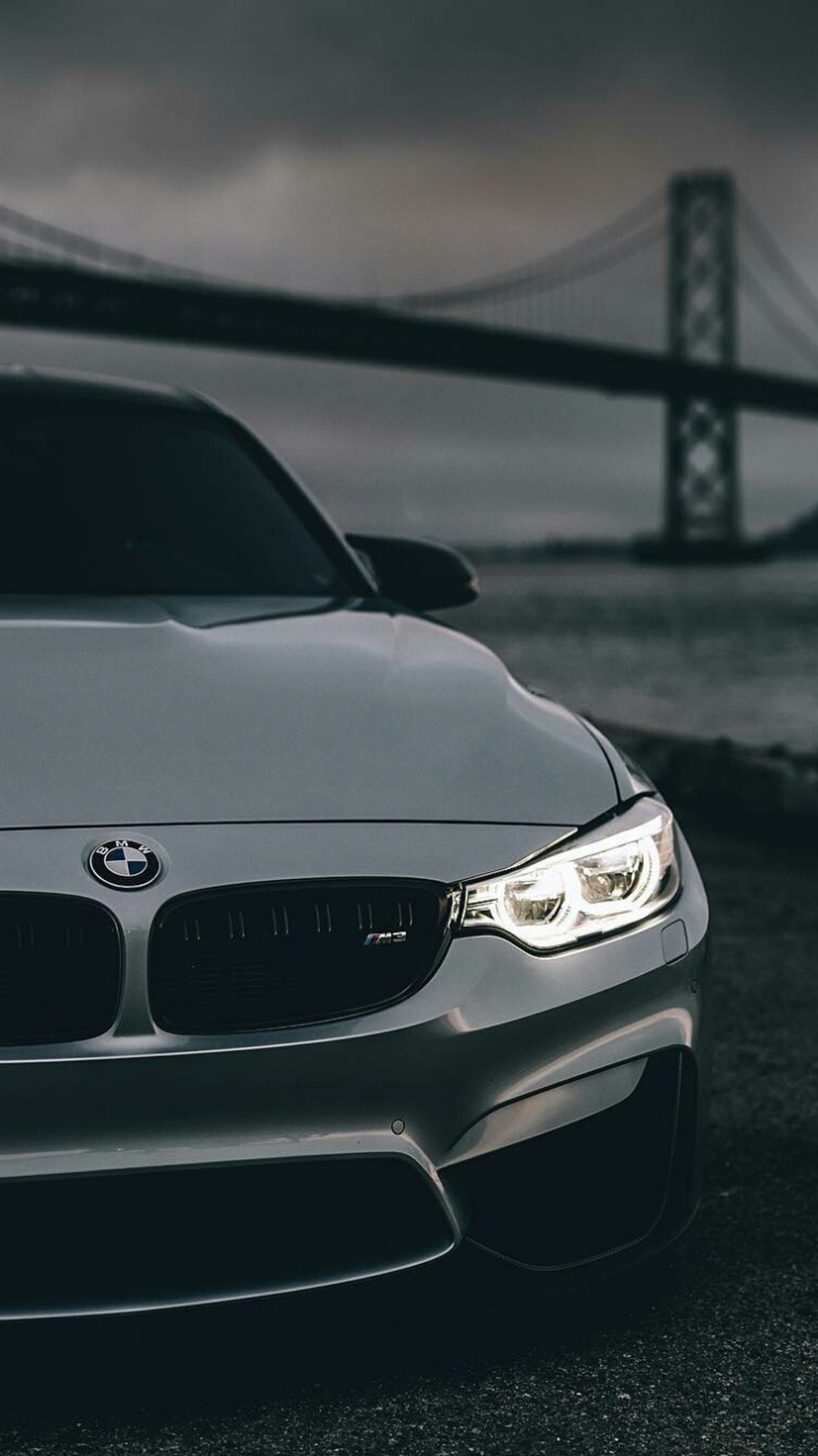 A close up of a car parked in front of a bridge (bmw, car, close up, f80, m power)