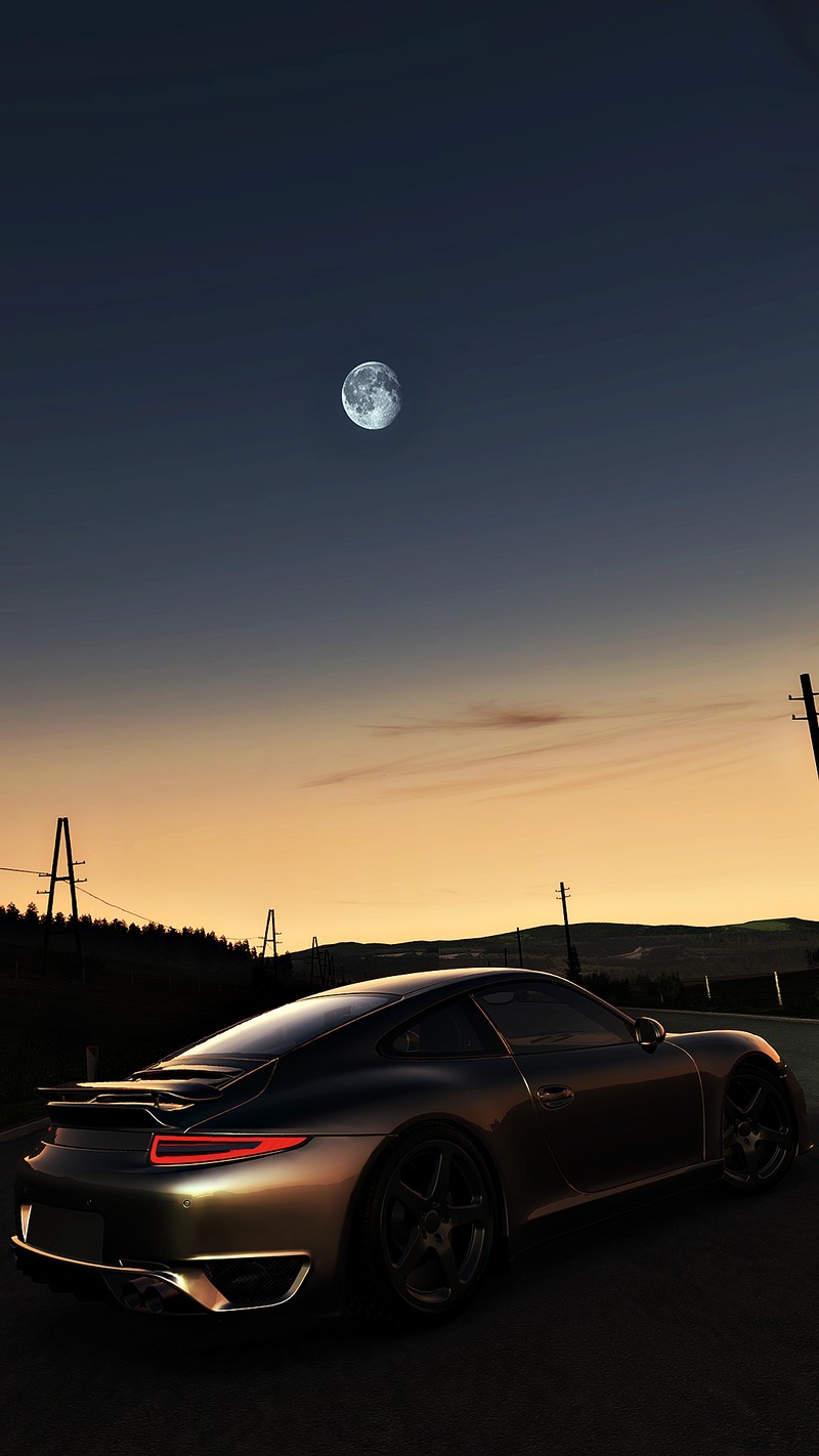 Un gros plan d'une voiture sur une route avec une lune dans le ciel (lune, nouveau, sympa, porsche, voiture de sport)