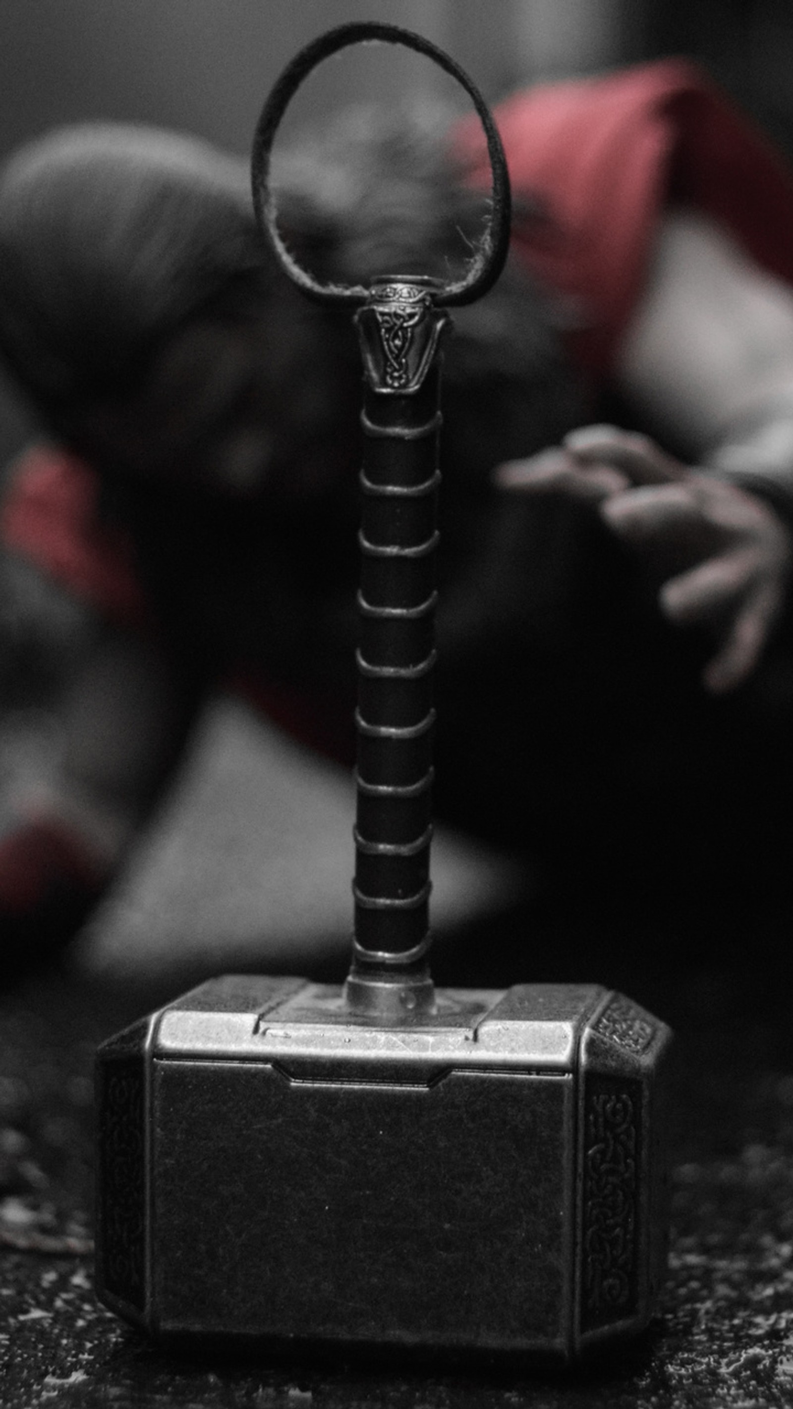 A close up of a hammer with a ring on it (hammer, thor)