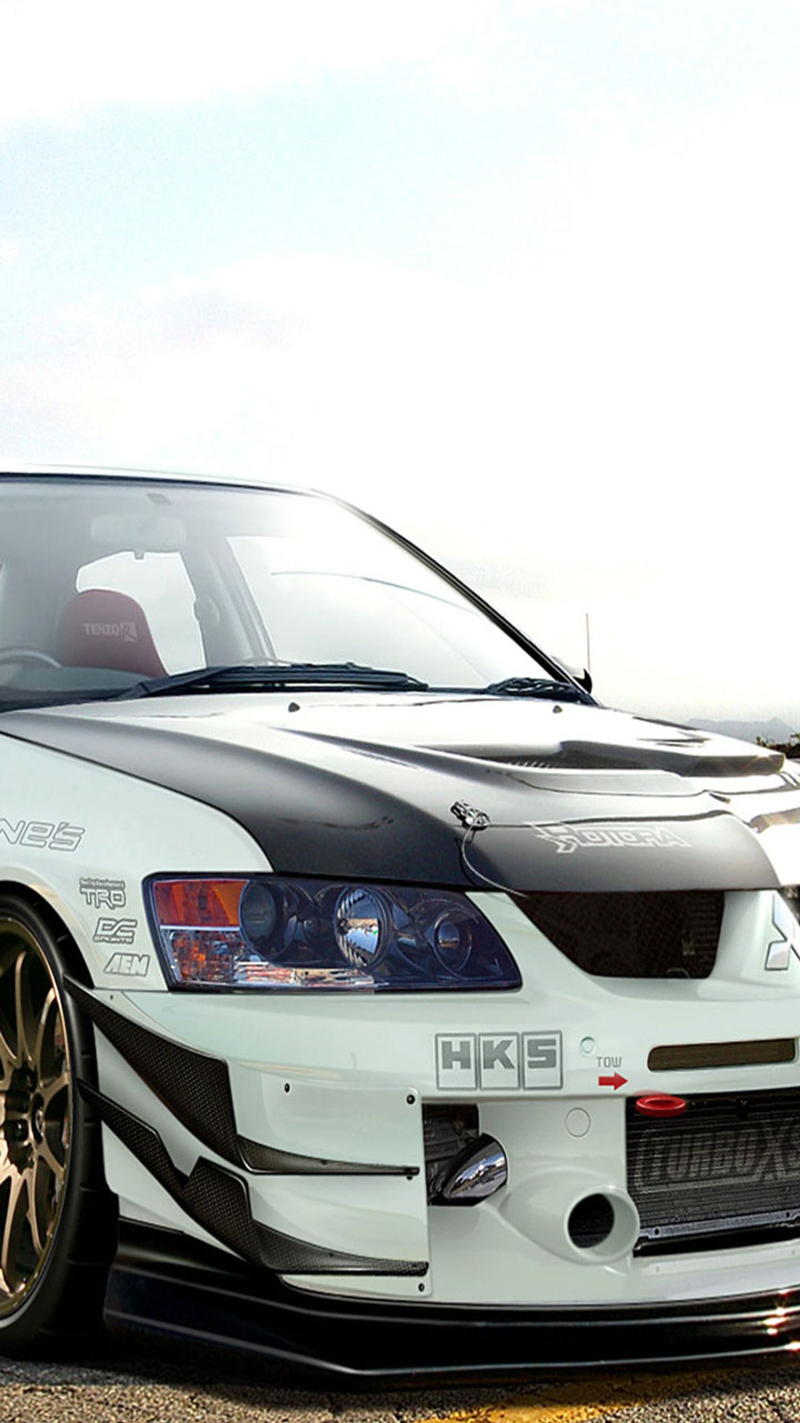 Arafed white car with black stripes parked on a parking lot (lancer, white)