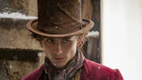 Timothée Chalamet as Wonka in a snowy scene from the 2023 movie.