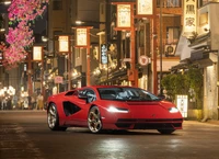 Lamborghini Countach LPI 800-4 in Vibrant Red Amidst a Lively Night Market Setting