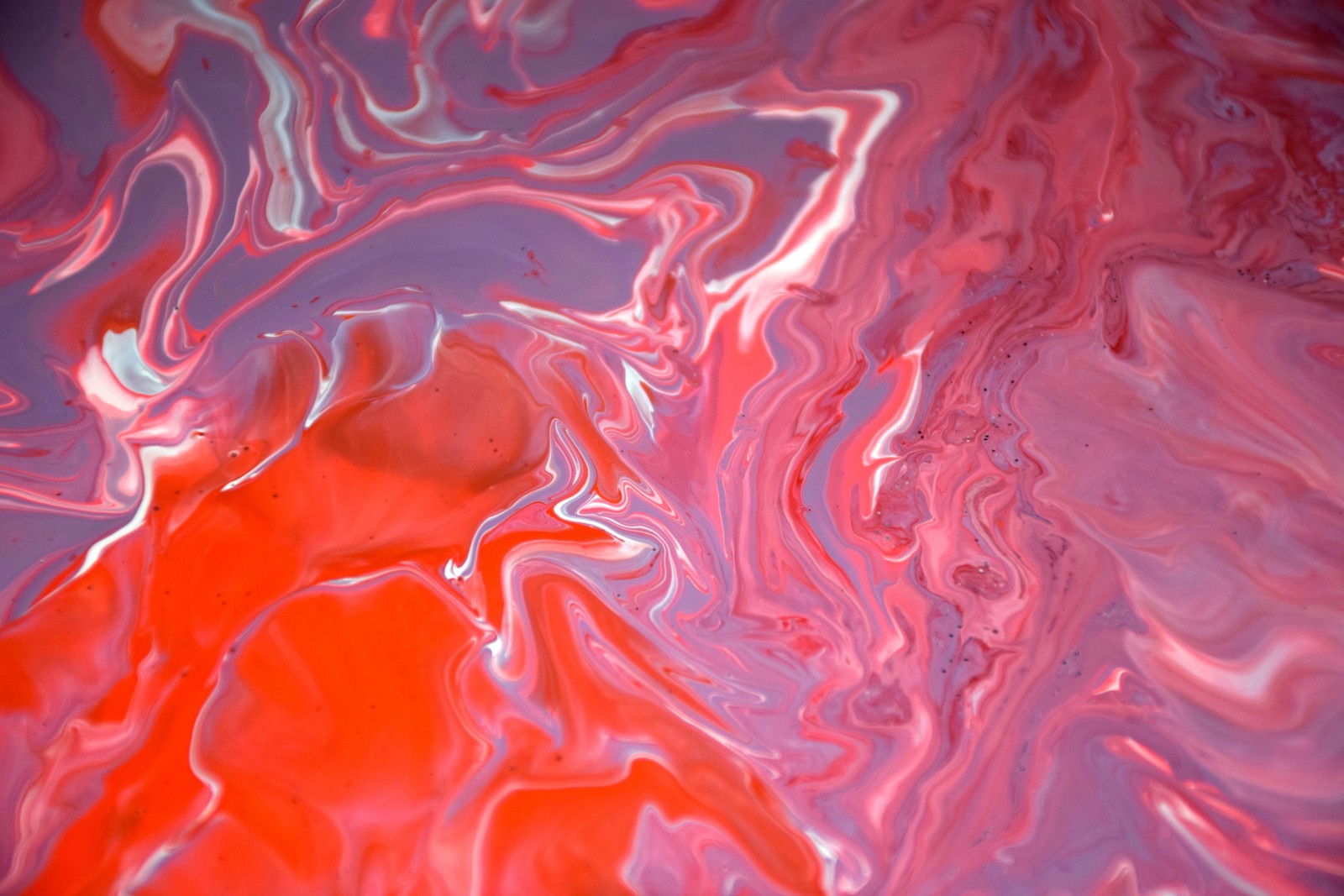 A close up of a red and blue liquid painting on a surface (color, abstract, newyear, newyou, zabstract)