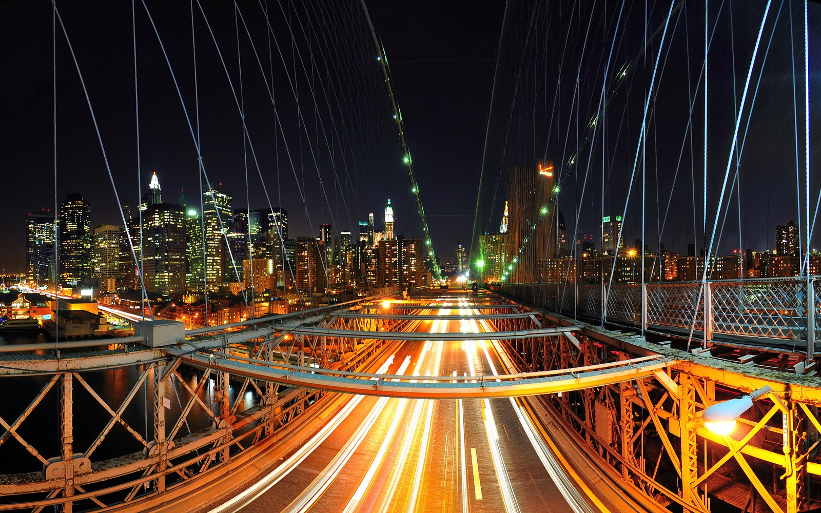 Arafed view of a city at night with a bridge and traffic (new york city, brooklyn bridge, skyline, night city, city lights)