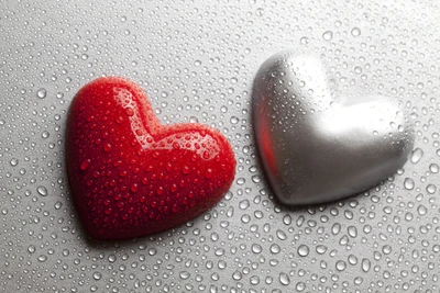 Red and Silver Hearts on a Raindrop-Dotted Surface