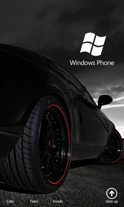 Interfaz de Windows Phone con coche negro y llantas elegantes