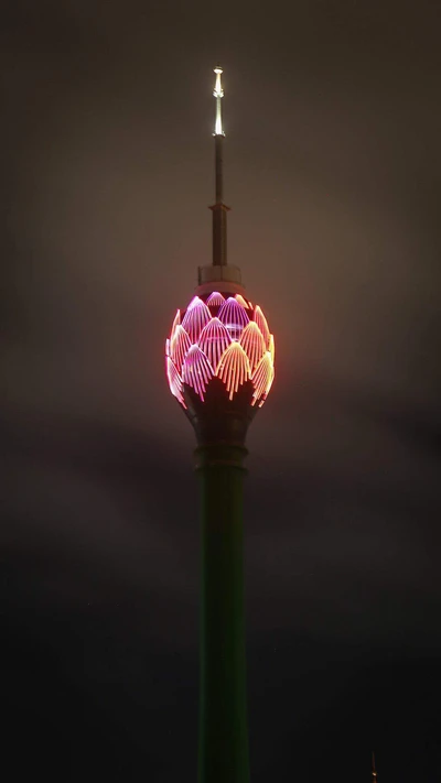 Illuminated Tower Against a Night Sky: A Beautiful Display of Light in Sri Lanka