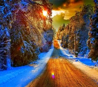 Sunset Over a Snow-Covered Road