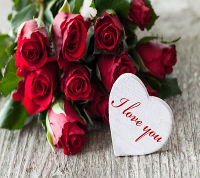 A bouquet of red roses accompanied by a heart-shaped card that says "I love you.