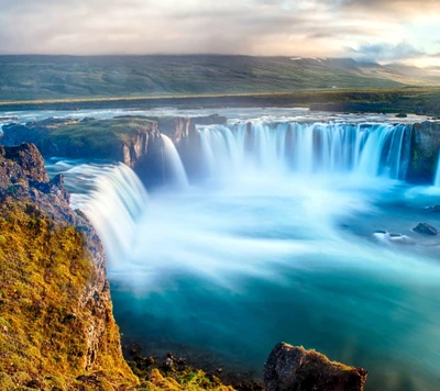 Majestic Waterfall Cascading into a Serene River