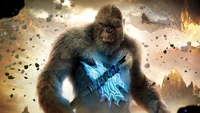 King Kong brandissant une hache lumineuse bleue dans une scène de bataille épique