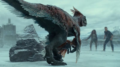 A fierce dinosaur-like creature with feathered wings towers over a dramatic landscape, as two humans face the impending threat in a scene from "Jurassic World Dominion.