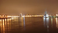 Paysage urbain nocturne avec des reflets sur l'eau