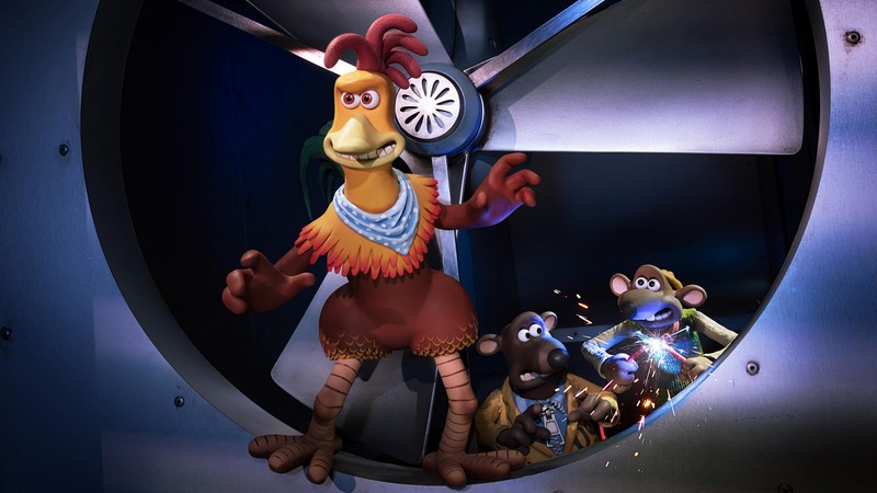 Girafes dans une structure métallique ronde avec une horloge et d'autres personnages animés (chicken run dawn of the nugget, netflix, film)