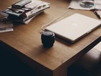 Stylish Workspace with MacBook and Camera Lens