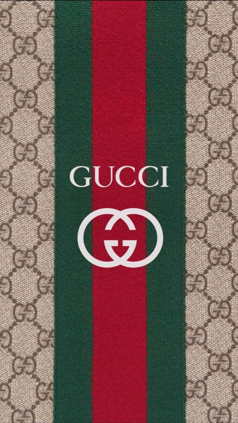 Крупный план логотипа gucci на красном и зелёном полосатом полотенце (дизайнер, гг, gg, логотип, монограмма)