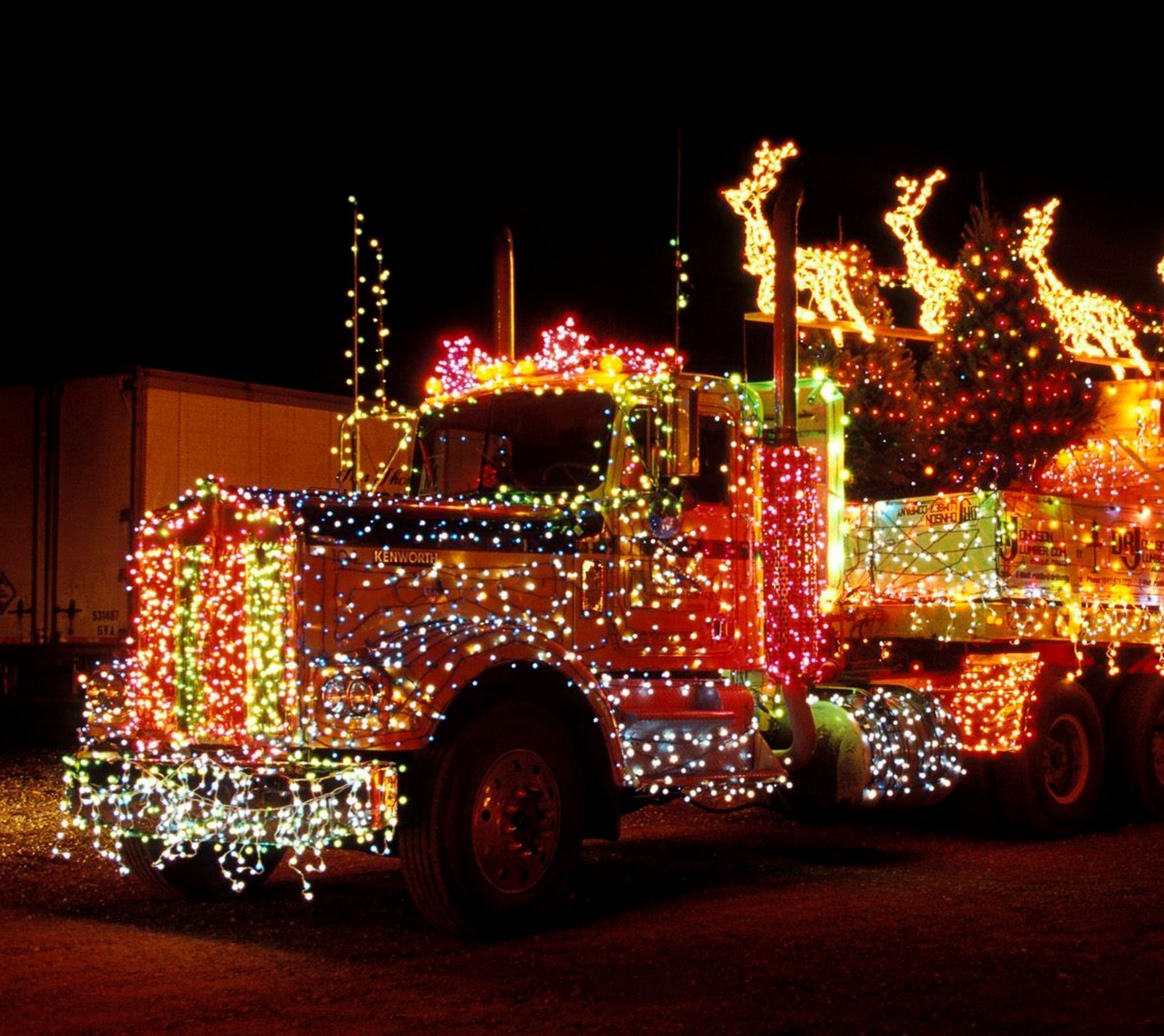 Araf truck with christmas lights on it parked in a parking lot (christmas, holiday, lights)