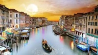 Scenic Sunset over the Grand Canal with Gondola and Rialto Bridge