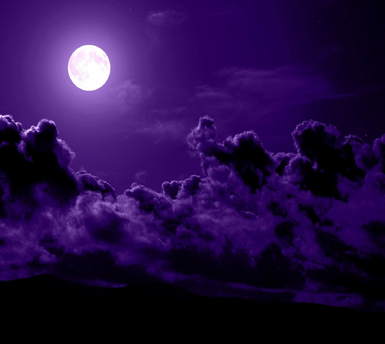 Purple moon in the sky with clouds and a mountain in the background (nature)