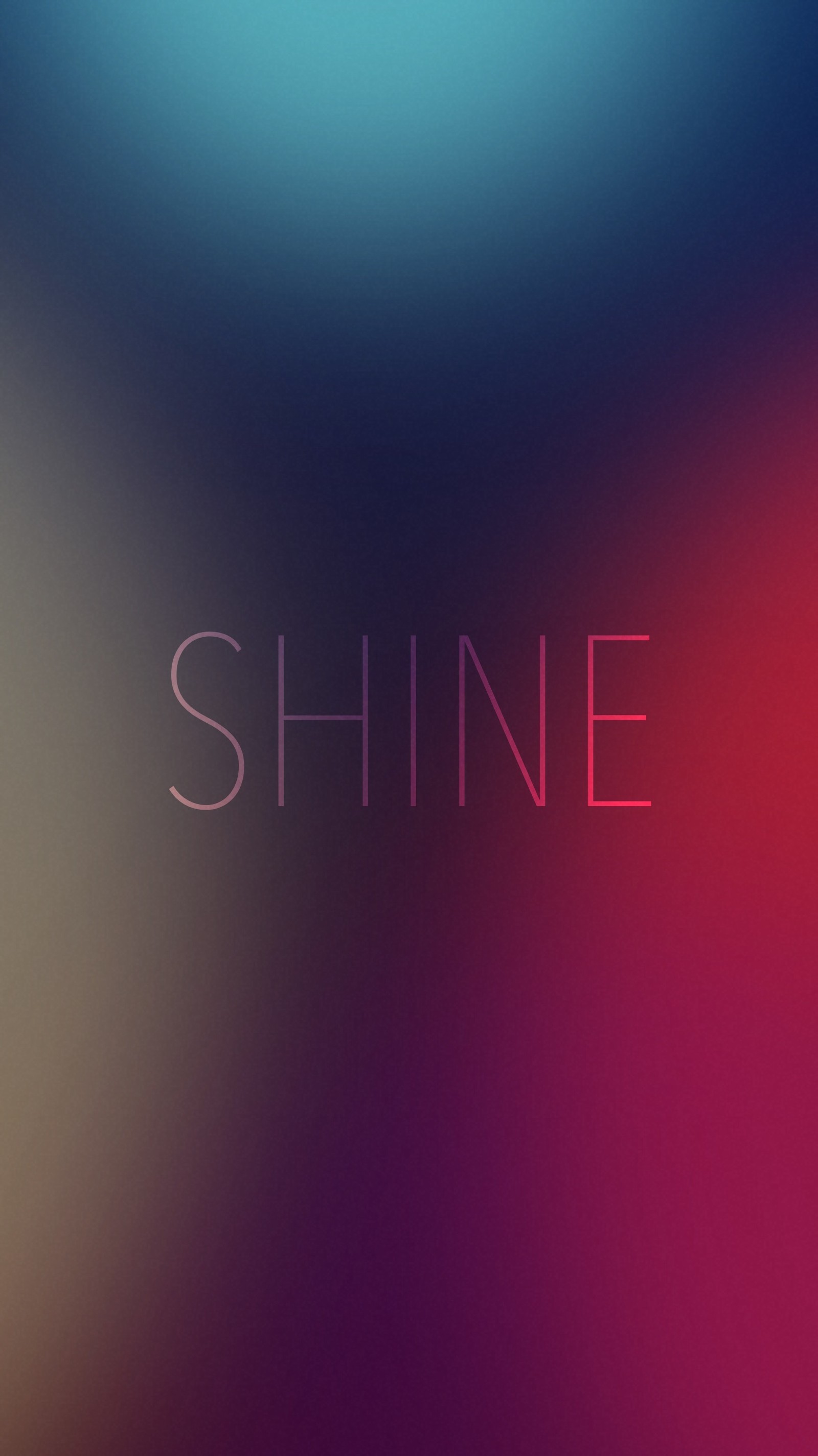 A close up of a blurry photo of a phone with the words shine (blue, blur, magenta, red, shine)